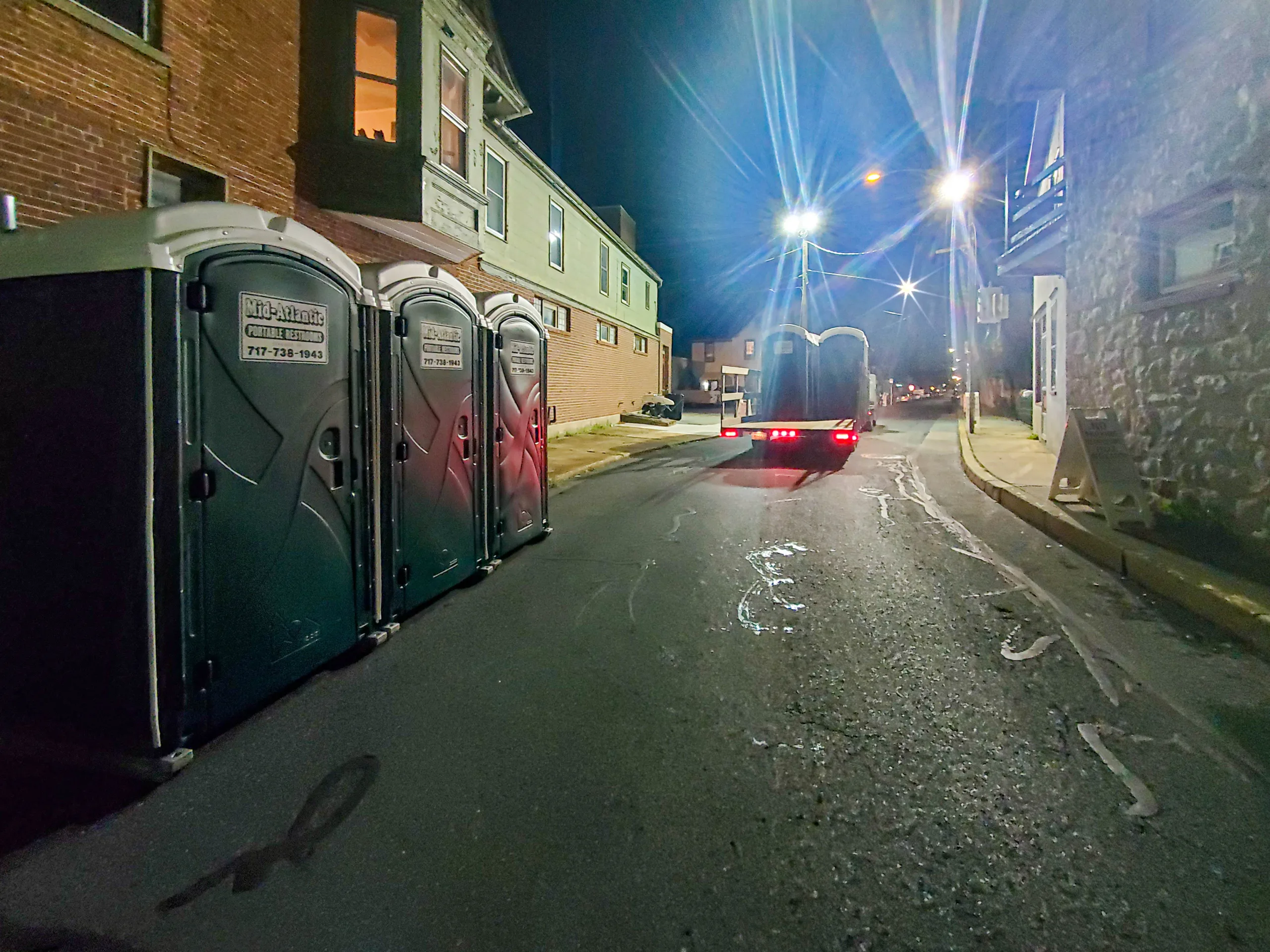 porta john rentals in a dark alley